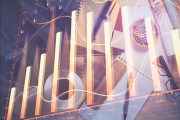 Double exposure of forex graph drawing and work table top veiw. Concept of financial analysis.