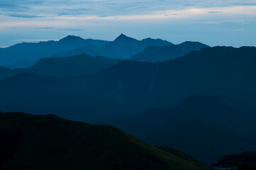 Sunrise over layers of mountains