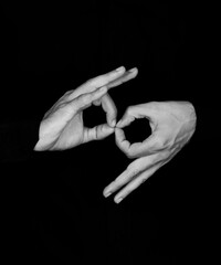mannequin and black and white photography demonstrating sign language using hands