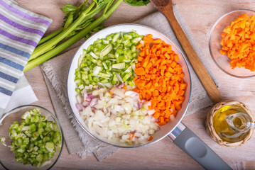 Cooking carrot and celery onion vegetable dressing, chopped ingredients for Mirepoix or Soffritto...