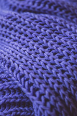 Handmade lilac knitting wool texture background. Warm cozy winter fall knitwear concept. close up