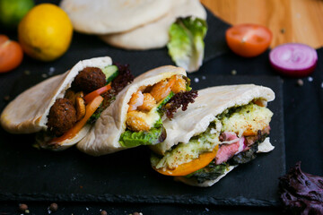 Doner kebab - fried chicken meat with vegetables in pita bread