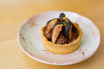 Close up of cute delicious Fig and Chocolate tart