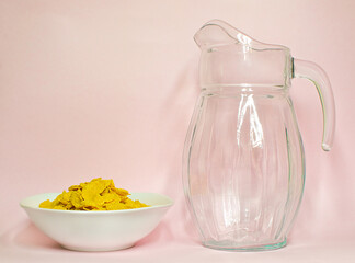 corn flakes and milk in a jug