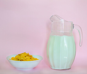 corn flakes and milk in a jug