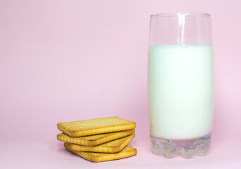 Milk Glass & Milk Cookies On pink Background