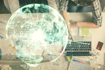 Double exposure of man and woman working together and business theme hologram drawing. Computer background. Top View.