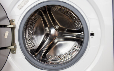Washing machine, close-up image, drum from the machine is sifting, cleanliness of the machine and...