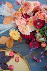 Autumn bouquet with orange red flowers
