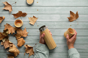 Zero waste coffee in bamboo cups from eco friendly insulated metal flask. Trendy flat lay with...