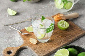 Glass of fresh mojito on table