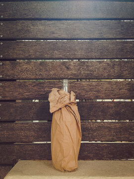 Bottle in a paper bag on the street