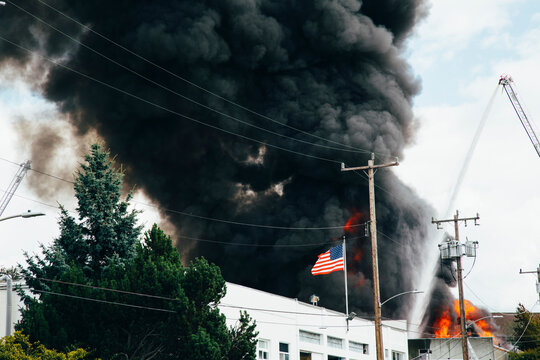 Smoke and flames rising into sky from 5-alarm fire