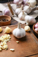 Composition with fresh garlic on wooden background