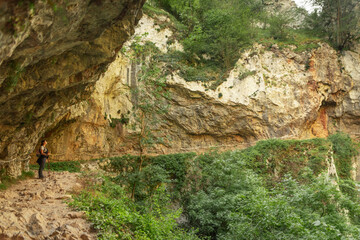 young woman hiking in mountain forest