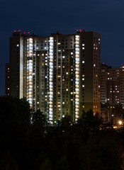 Fototapeta na wymiar Facade of a residential building at night