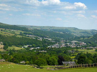 Fototapeta na wymiar scenic view of the town of mytholmroyd surrounded by woods and fields in the calder valley west yorkshire