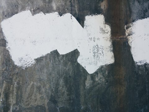 white paint on a city wall