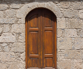 Old Medieval door in a stone wall