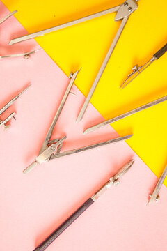 Patternof accessories for techinc drawing on yellow-pink background.