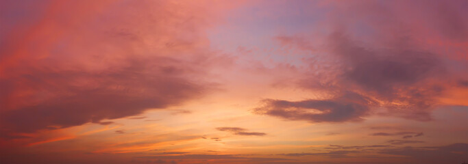 Naklejka na ściany i meble Dramatic cloudy sky at sunset in the evening