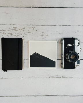 Notebook, printed image and vintage russian camera