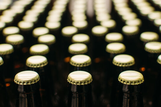 capped beverage bottles in rows