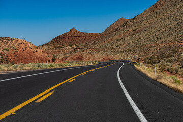 Side view asphalt road on sunny summer day. Highway, Arizona, USA.