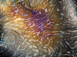 closeup macro of patterns colors textures on handmade fluted glass bowl