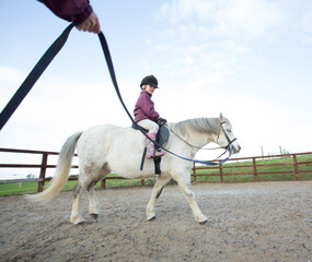 Mother with her daughters and their pony.