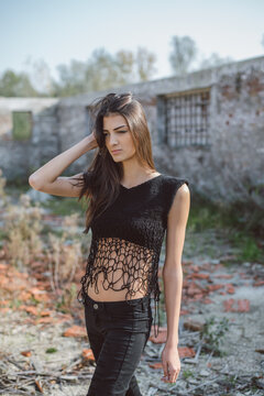 Beautiful model posing in black knitted outfit
