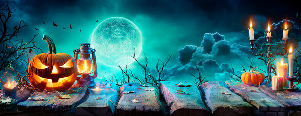 Jack O’ Lantern On Table In Spooky Night - Halloween With Full Moon
 - obrazy, fototapety, plakaty