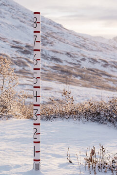 Less than a foot of snow measurement pole in Alaska