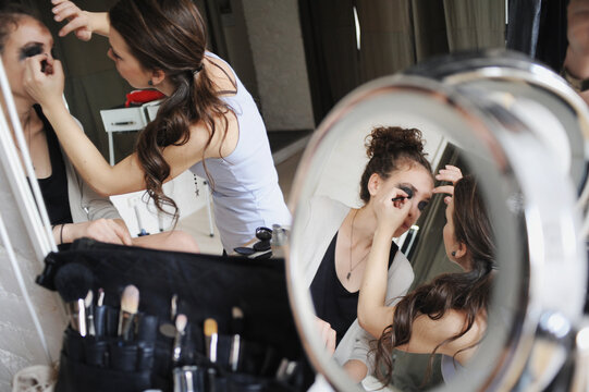 Woman make up artist is working