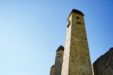 Obraz premium Old stone tower. Ancient stone building of old town