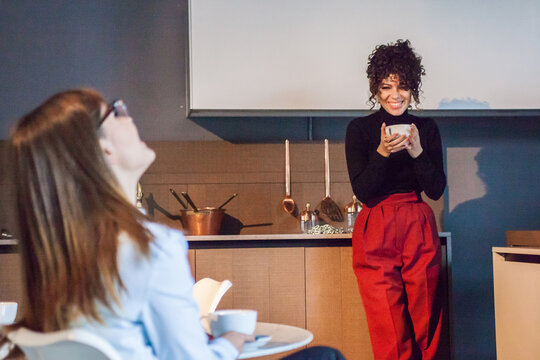 Stylish women chat.