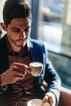 Young Businessman Drinking Coffee