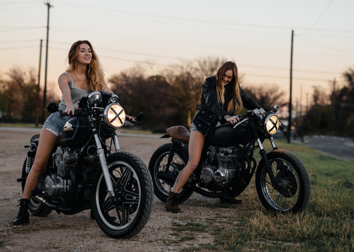 Attractive girls riding vintage motorcycles