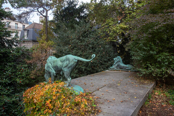 Sculptures of lions in Garden of plants in Paris