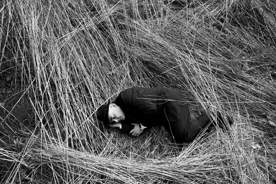 man lying on the ground int the suit
