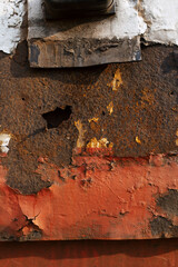 rust in the center next to the paint. rust texture in the center of the frame and white paint