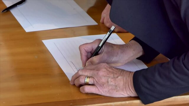 People Signing The Covid19 Contact Tracing List When Entering Premises In New Zealand After Lock Down
