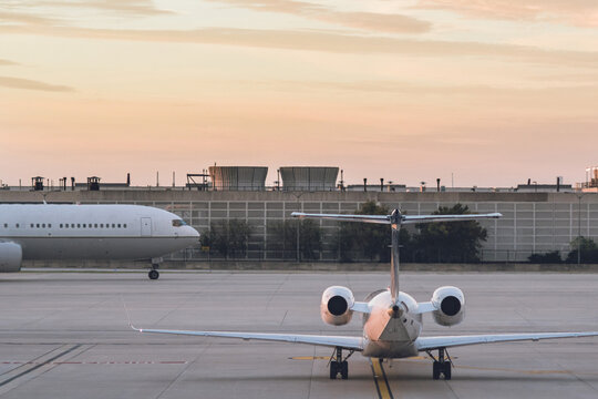 Large, busy airport with planes taxiing