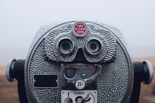 Binocular telescope camera on a foggy beach during the winter months in Maryland