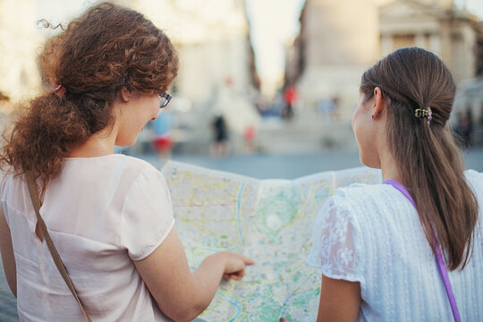 Tourists Looking for Places on a Map
