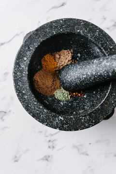 mortar and pestle, made of granite with spices