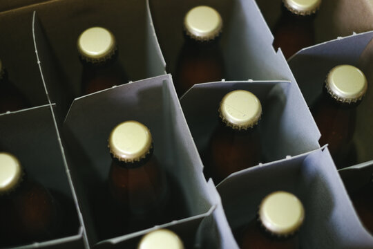 Tops of beer bottles boxed up