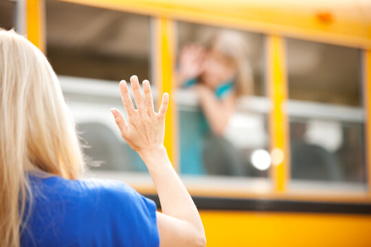 School Bus: Focus on Hand Waving Goodbye