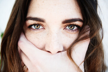 Portrait of a woman held in the hand of the photographer