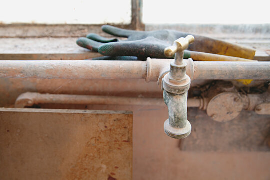 close up of old textured walls, taps and electrical points